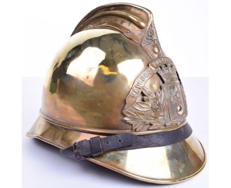 French Fire Brigade Dress Helmet, brass Adrian style helmet with central brass helmet plate, top comb having flaming grenade 