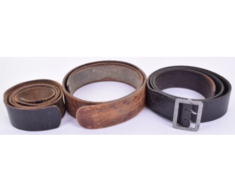 Three WW2 German Leather Belts, consisting of officers black leather claw belt which has SS rune and RZM stampings, brown lea