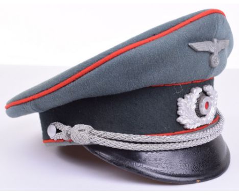 WW2 German Army Artillery Officers Peaked Cap, early war type example with red piping to the crown and bordering the central 