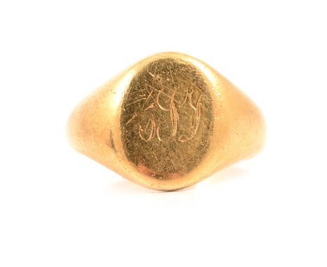 An 18 carat yellow gold signet ring, oval head with lightly engraved initials, ring size J/K, Birmingham 1961, 7.4g.Condition