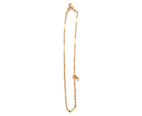 A yellow metal fancy link Albert watch chain, alternating 14mm long double bar links and groups of five twisted links, pad st