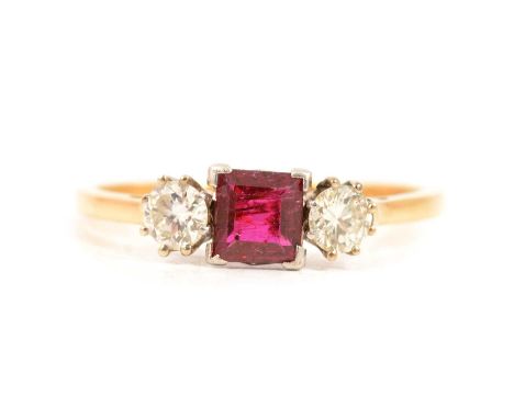 A ruby and diamond three stone ring, a 5.7mm square cut ruby and two brilliant cut diamonds claw set in a yellow and white me