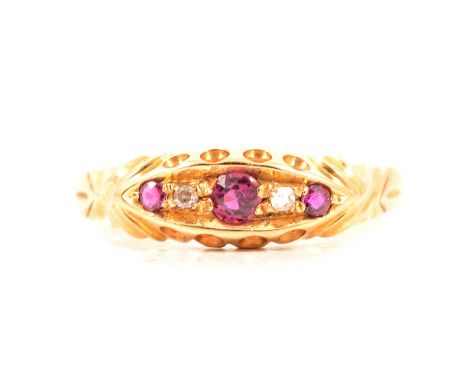 A Victorian style ruby and diamond ring, three rubies and two old cut diamonds set in an 18 carat yellow gold boat shape moun