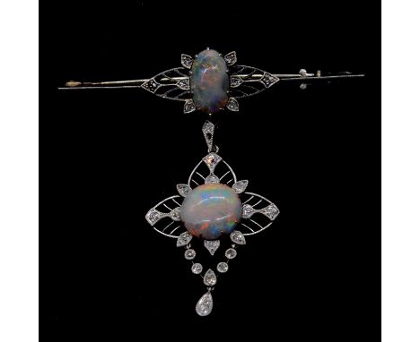 An opal and diamond brooch with pendant drop, an oval cabochon cut opal 12x7mm claw set to the centre of a 55mm long white me