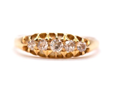 A diamond five stone ring, the five old cut diamonds graduating in size, claw set in an 18 carat all yellow gold mount ring s