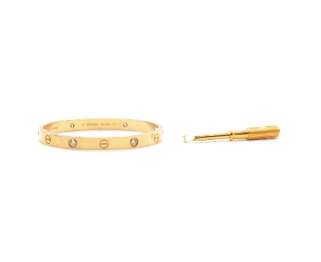 Cartier - a diamond set Love Bangle, the 6mm wide yellow metal bangle set with four collet set brilliant cut diamonds, signed