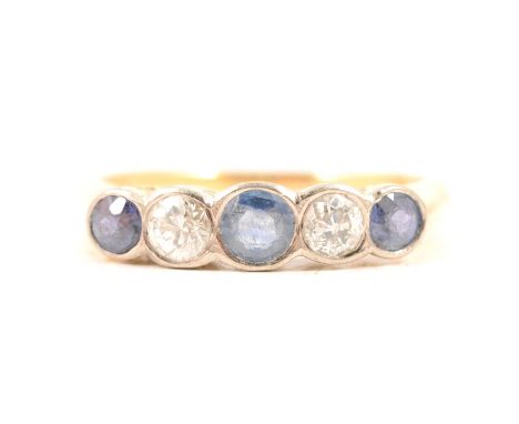 A sapphire and diamond five stone ring, three sapphires and two old cut diamonds collet set in a yellow and white metal half 
