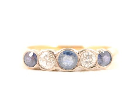 A sapphire and diamond five stone ring, three sapphires and two old cut diamonds collet set in a yellow and white metal half 