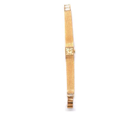 Tissot - a lady's 9 carat yellow gold manual wind wristwatch, 13mm diameter square champagne baton dial in a 14mm 9 carat yel
