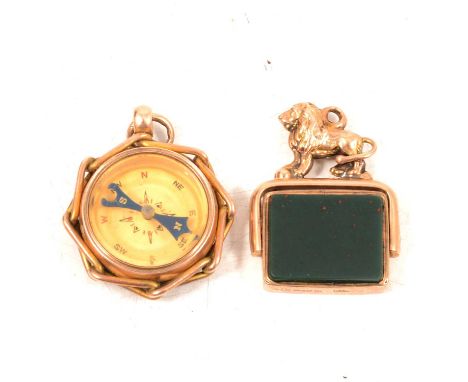 A 9 carat gold compass charm and a bloodstone fob, a 9 carat yellow gold compass charm, with a circular cornelion to undersid