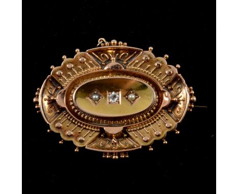A Victorian 15 carat yellow gold oval brooch, 35x28mm, wire work and shot decoration, dish shaped oval centre set with an old