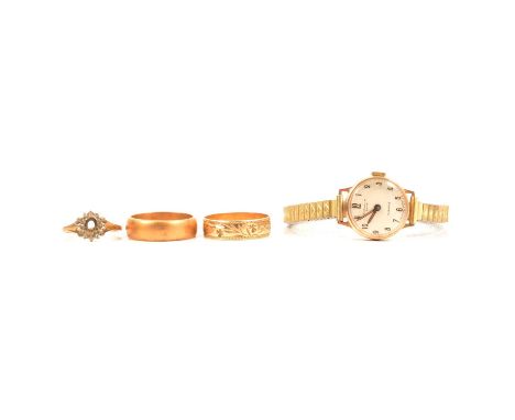 Two wedding rings, ring without a stone and lady's 9 carat yellow gold wristwatch, a 9 carat yellow gold wedding band, 6.4mm 