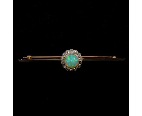 An opal and diamond bar brooch, the 7mm round cabochon cut opal millegrain set and surrounded by fourteen 8 cut diamonds as a