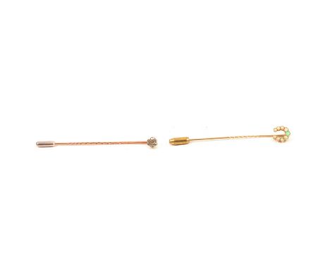 Two tie pins, opal and diamond, a yellow metal pin with an inverted horseshoe millegrain set with nine small cabochon cut opa