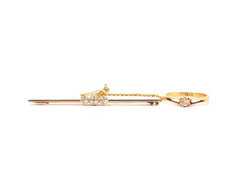 A diamond bar brooch and a small diamond solitaire ring, a diamond bar brooch, three 8 cut diamonds illusion set on a 60mm lo