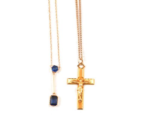 A blue stone necklace and a gold crucifix on chain, a blue stone necklace, the emerald cut blue stone suspended from a bar be