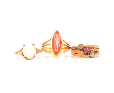 A carved shell cameo ring, a ruby and diamond three shank ring, and an opal ring, a carved shell cameo ring, the marquise cut