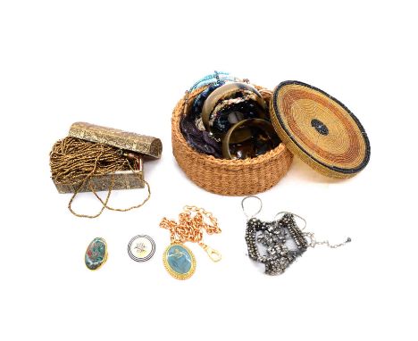 A beaded basket and brass finish jewel casket with costume jewellery, bead bangles and necklaces; horn design bangle, ring an