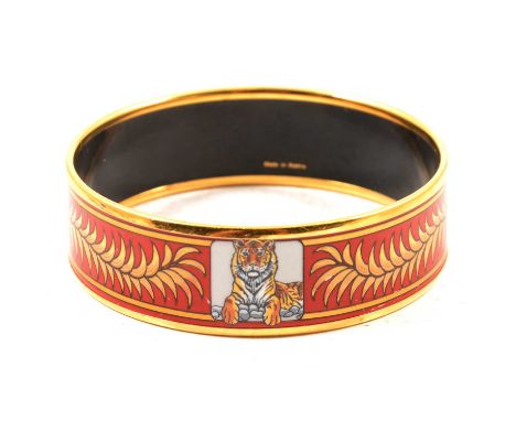 Hermes Paris - a Royal Tiger (Tigre Royal) gold-plated and enamel bangle, red ground, 18mm wide, internal diameter 60mm, Made
