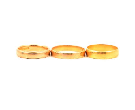 Three 22 carat yellow gold plain polished wedding bands, 4.8mm half D shape wide ring size O, Birmingham 1938; a 3.7mm half D