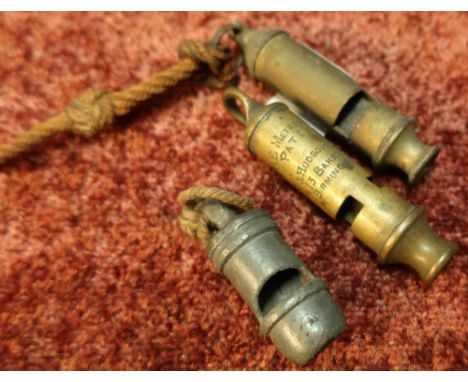 Three vintage whistles including The Metropolitan, J Hudson &amp; Co 