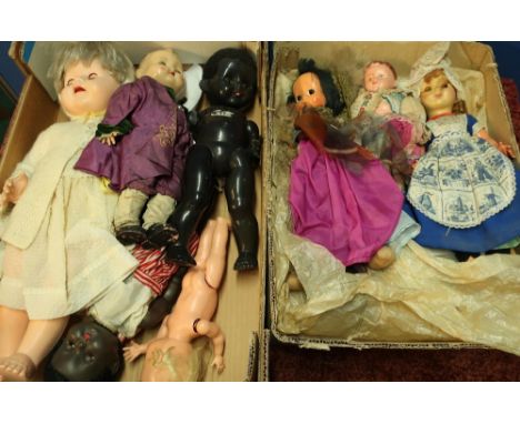 Five circa 1950s hard plastic dolls and three other vintage costume dolls including a celluloid based doll, in two boxes 