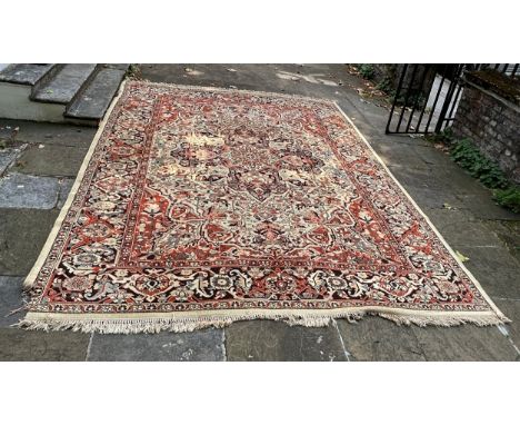 A LARGE WOOL CARPET