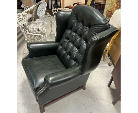 A GREEN LEATHER BUTTON BACK RECLINING ARMCHAIR, 110cm x 83cm x 83cm