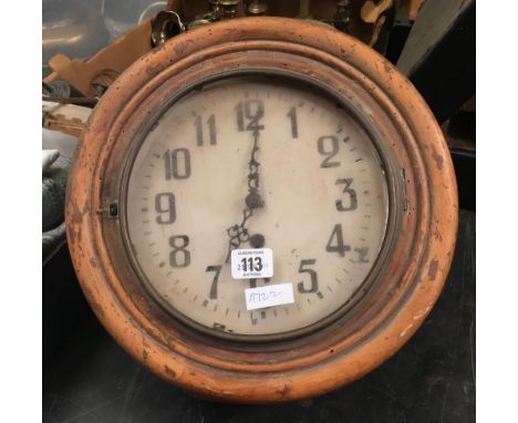 AN OLD WOOD WORMED WALL CLOCK