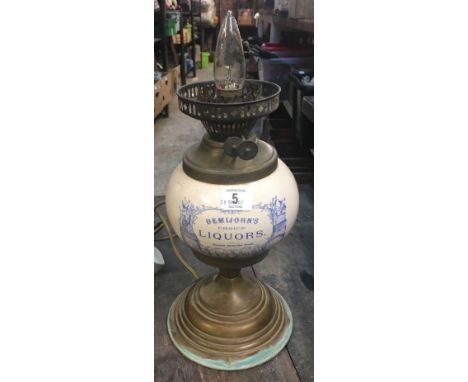 VINTAGE OIL LAMP CONVERTED TO ELECTRICITY WITH CHINA RESERVOIR WITH NAME DEMIJOHNS CHOICE LIQUORS 