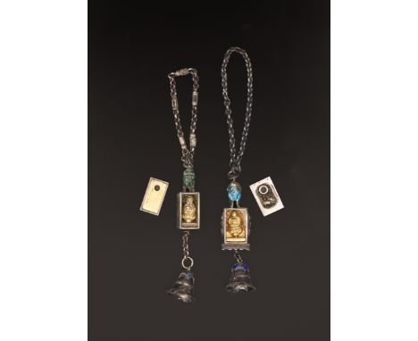 TWO CHINESE SILVERY METAL AND ENAMEL BUDDHA PENDANTS, QING DYNASTY, LATE 19TH/EARLY 20TH CENTURY清 長命富貴銀鎖及珐琅佛像掛件一组 两件 十九至二十世紀初
