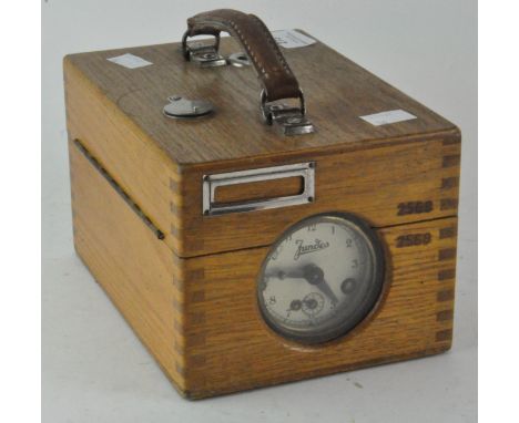 A 'Jundes' wooden cased pigeon clock, German made, 21cm long