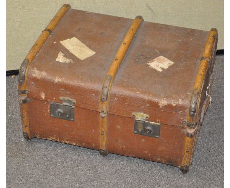 An unusual metal and leather bound steamer trunk; together with a smaller trunk