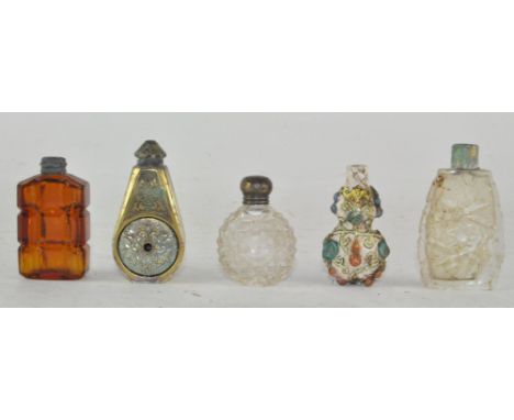 A group of assorted scent bottles, comprising three glass, one ceramic and one metal, one of these having silver lid, largest