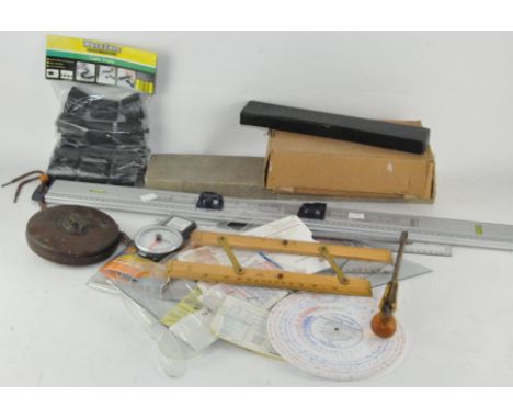 Various tools, including a Rabone tape and other measuring related items