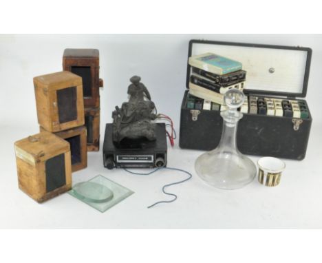 An assorted group of items, including carriage clock cases, decanter and more