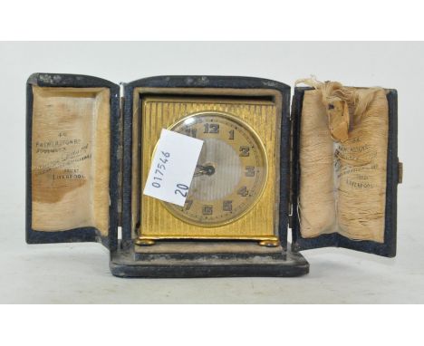 A small travelling Zenith clock, in original fitted box, Swiss made, the dial with Arabic numerals denoting hours
