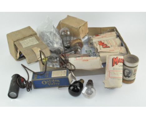 A collection of vintage light bulbs and valves, some in boxes