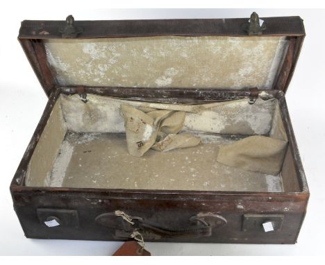 A vintage distressed leather suitcase, 17cm high x 55cm wide x 33.5cm deep