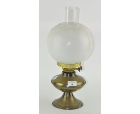 A vintage brass oil lamp with glass shade and funnel, 42cm high