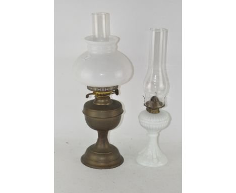 An early 20th century oil lamp, by Duplex, with glass shade and funnel; together with a white glass lamp, lacking shade