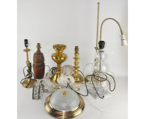 A collection of assorted lamps, to include a brass oil lamp base, glass ceiling light and more
