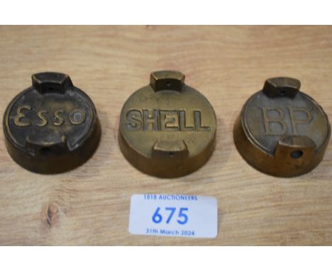Three vintage petrol can caps Shell, Esso, and BP