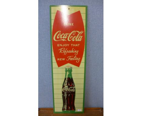 A vintage painted Coca-Cola advertising sign 