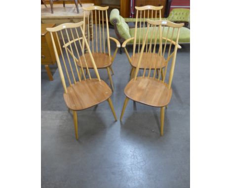 A set of four Ercol Blonde elm and beech Goldsmith chairs 