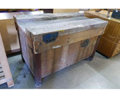 An industrial pine work bench 