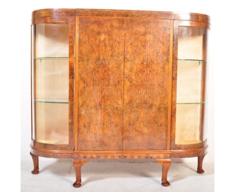 A vintage 20th century Art Deco circa 1930s burr walnut bow fronted china display cabinet. The display cabinet having a strai