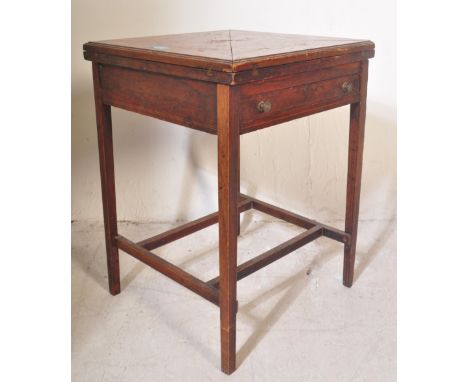 Manner of Edwards & Roberts. An Edwardian rosewood inlaid envelope card table. Of square form with fold over corners revealin