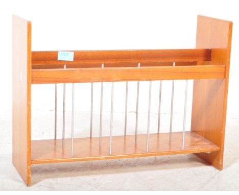 A vintage mid 20th Century1970's&nbsp; teak wood magazine rack. The rack having three sections with wire work supports.&nbsp;