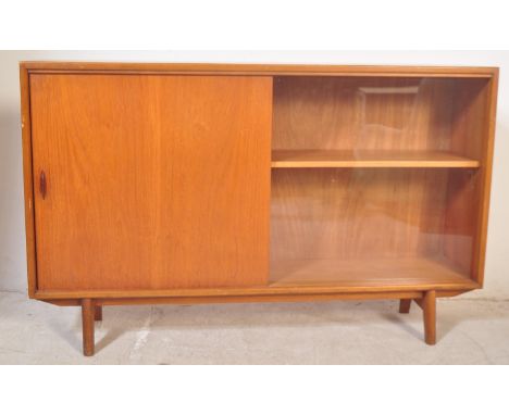 A retro vintage mid 20th century circa 1960s teak wood side glazed display cabinet bookcase having sliding doors, one wood &a